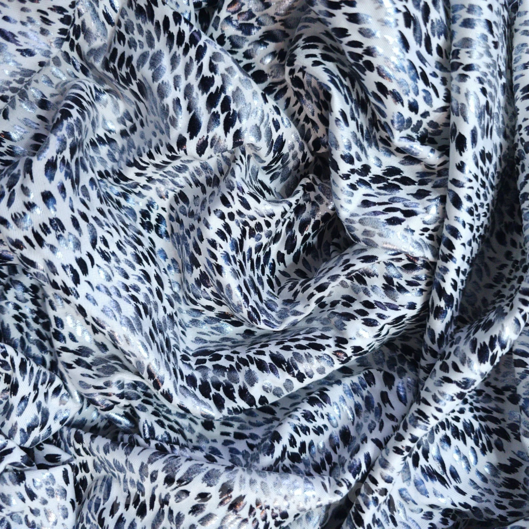 Lycra Lamé / animal print blanco foil 1/2 mt